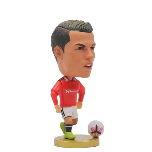 Ronaldo figurine with a red jersey and green cleats on a white background