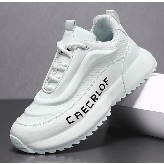 White sneaker with 'CAECROF' branding on a gray background