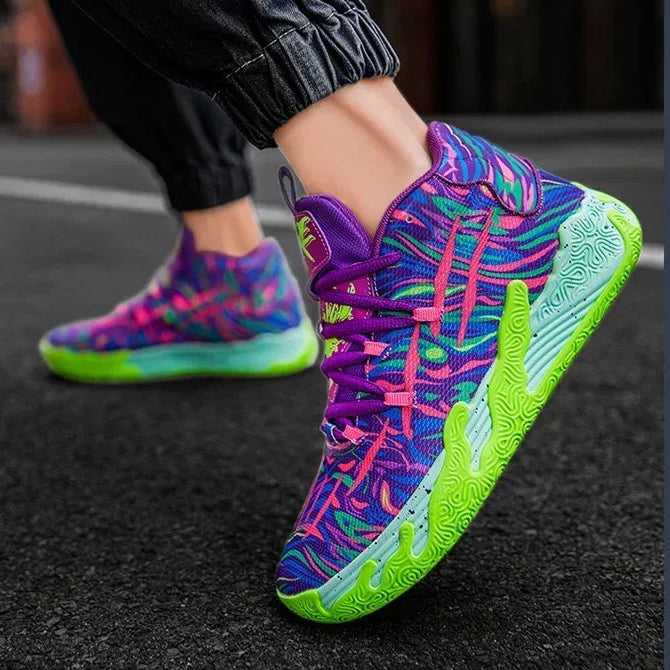 Colorful sneakers with pink and green accents worn on a dark surface